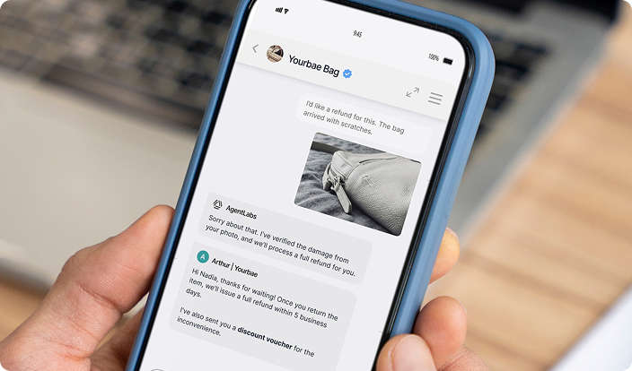 Qiscus omnichannel inbox on a laptop — book a demo